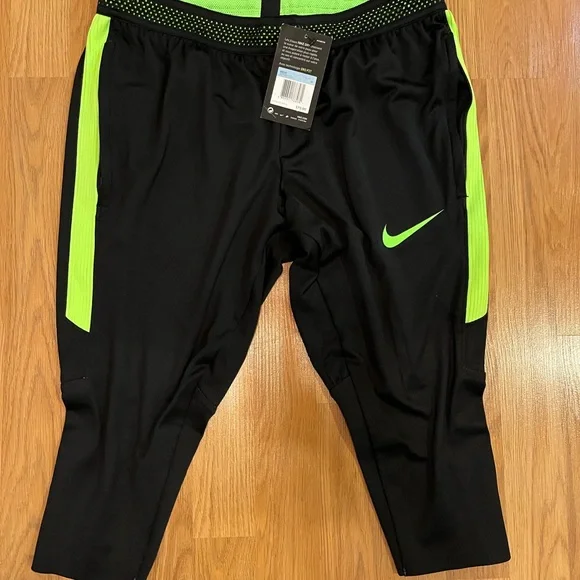 Nike Dri-Fit Men’s knee length legging/black w neon green/zippered side pockets. - Picture 2 of 3